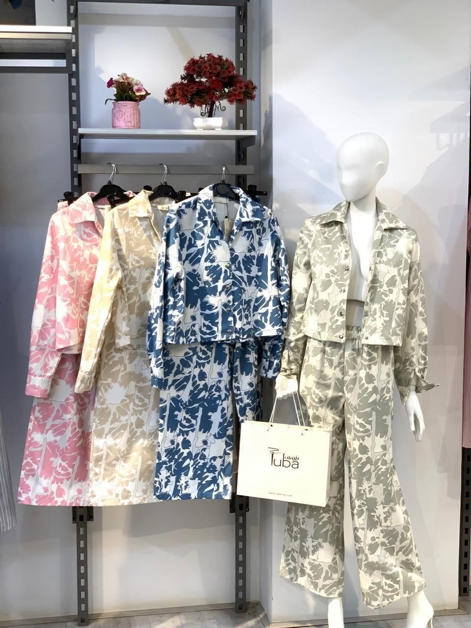 Floral-print jacket and trouser sets in pink, blue and sage
